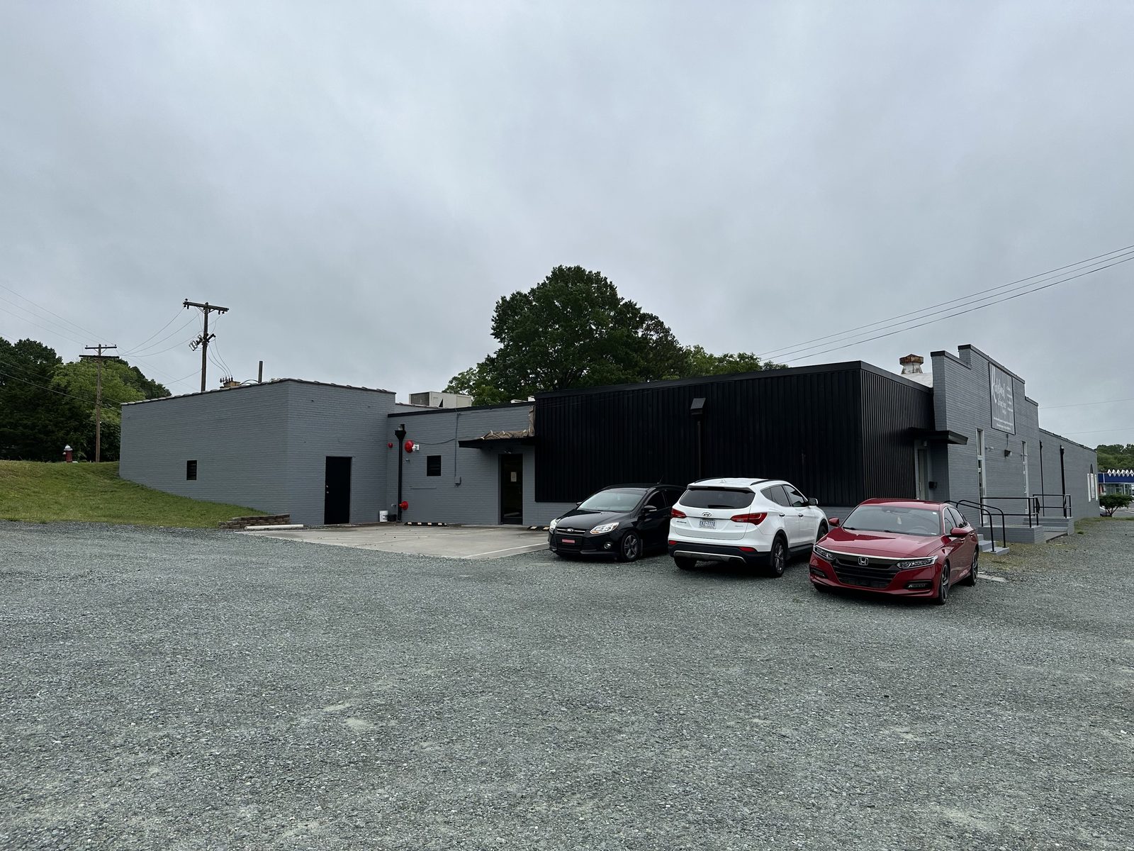 Warehouse and office building exterior painted dark gray