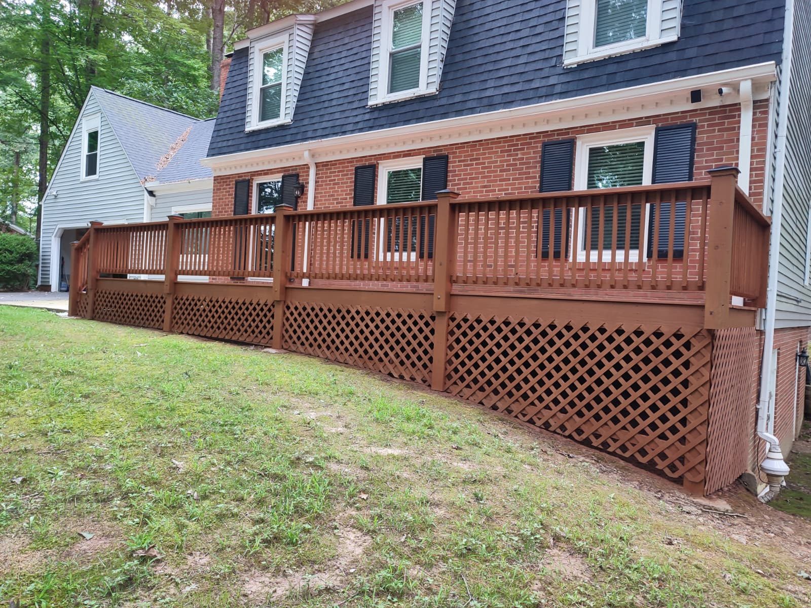 Deck boards and railing re-stained after pressure washing