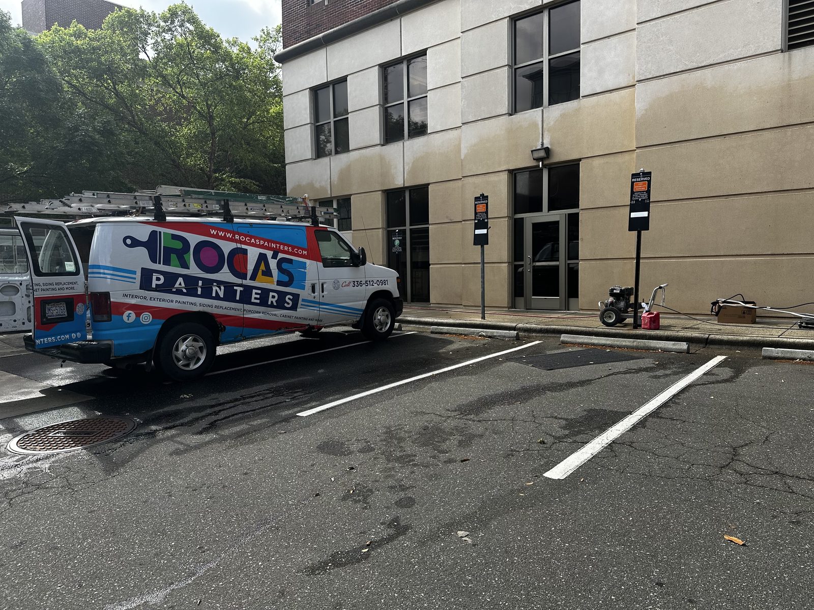 Roca's Painters van parked at a commercial job site