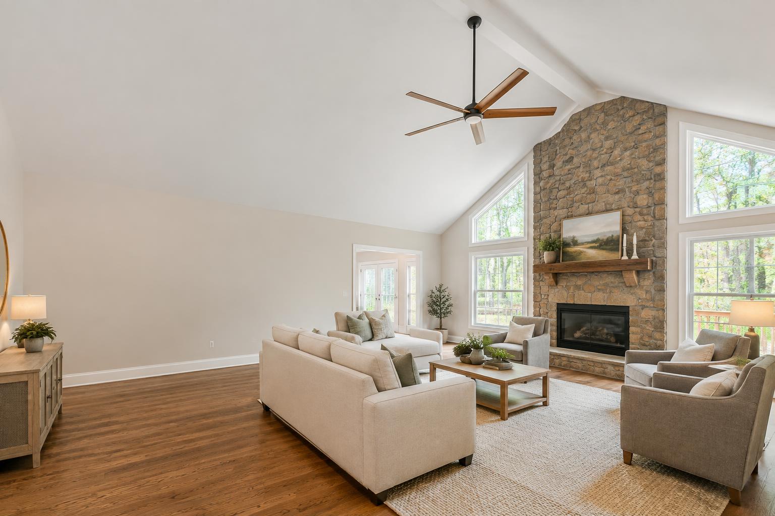 Bright living room with a smooth freshly painted vaulted ceiling — popcorn ceiling removal by Roca’s Painters of Mebane, NC